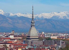 Turin, an Italian city in the foothills of the Alps. The soaring spire dwarfing the church to its left belongs to the Mole Antonelliana, originally designed as a synagogue