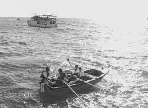 Dressed for the part, re-enactors playing illegal immigrants prepare to disembark at Tel Aviv beach