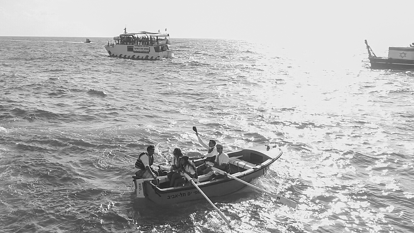 Immigrant Waves
Ariel Zuckerman Dressed for the part, re-enactors playing illegal immigrants prepare to disembark at Tel Aviv beach