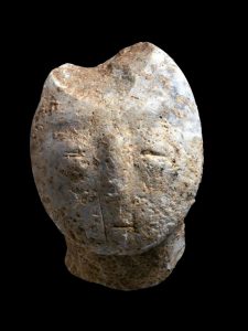 Human face carved in stone