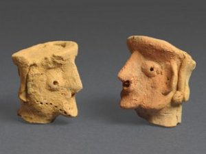 Head-shaped figurines from Motza